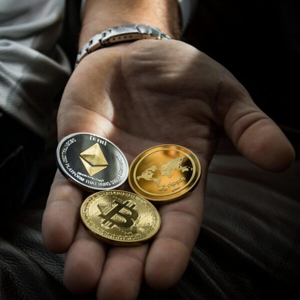 Closeup Photo of Three Round Coins in Person's Palm